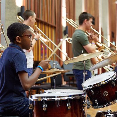 student playing drums